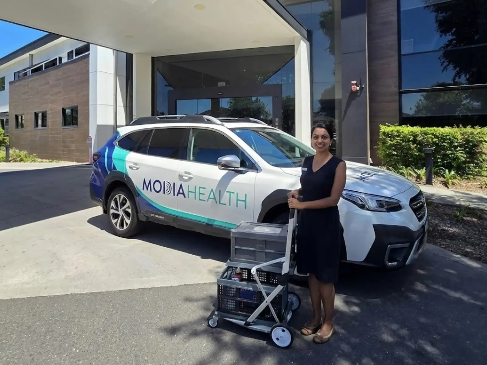 A mobile health clinician with their branded vehicle, photographed on site by Red Ox Digital