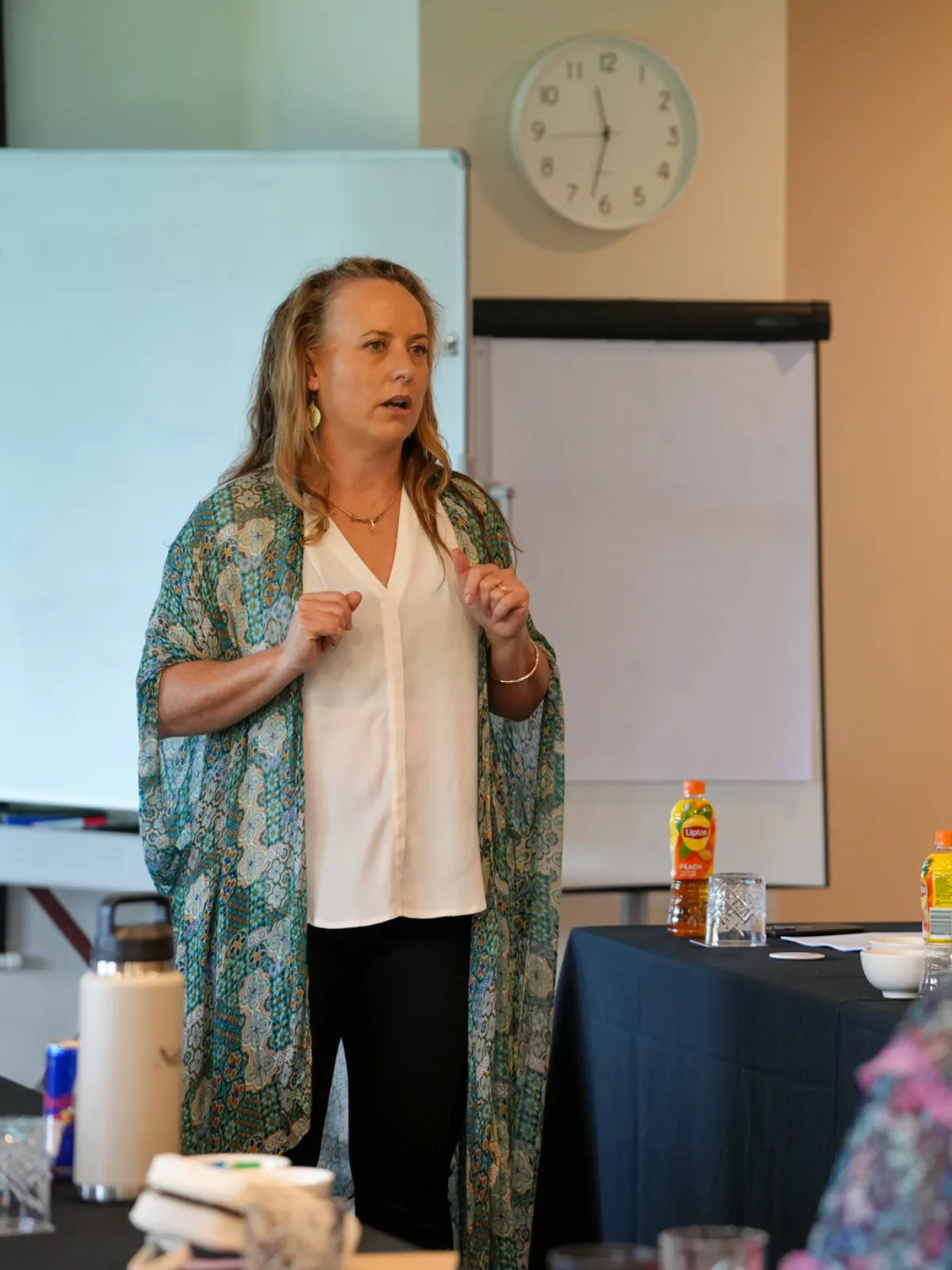 A business owner presenting to a room, photographed on site by Red Ox Digital