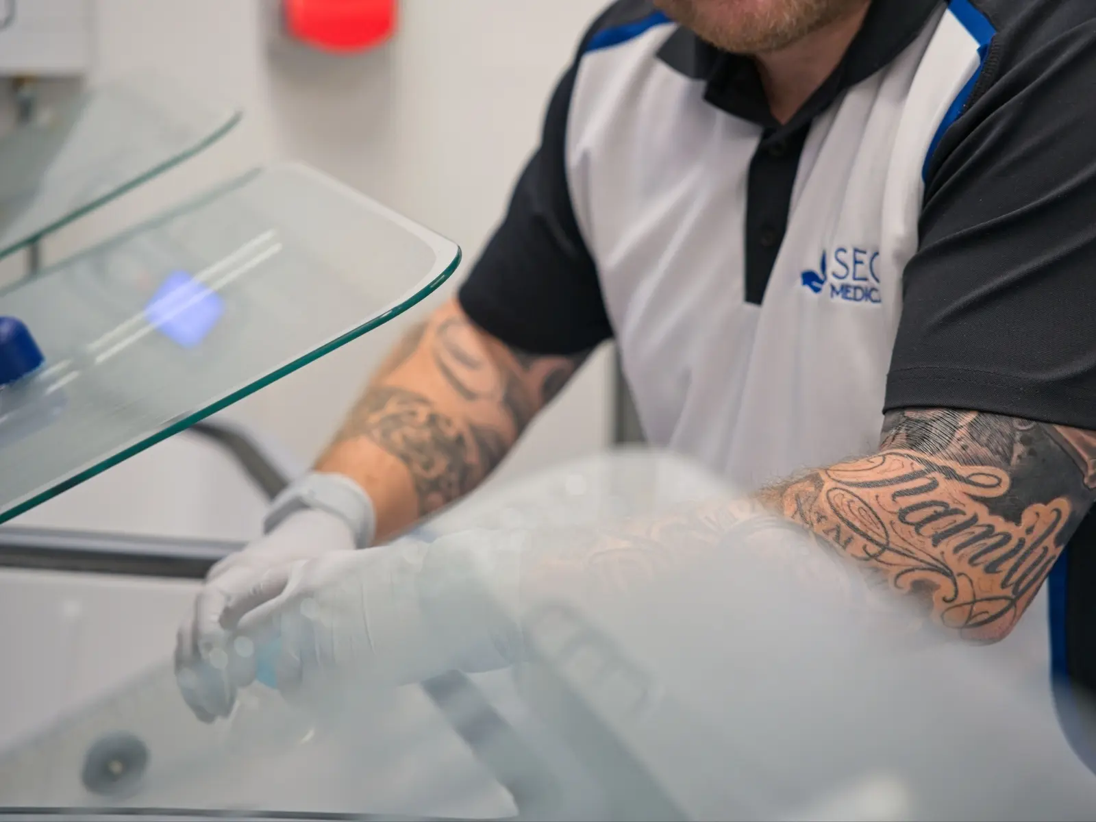 A clinic technician at work, photographed on site by Red Ox Digital